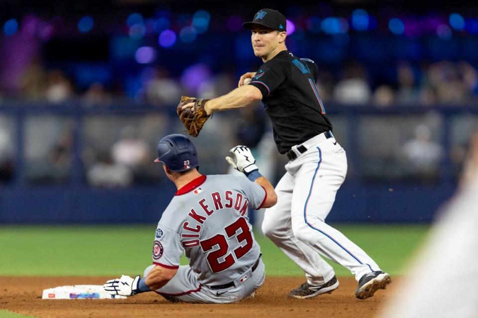 Miami Marlins short stop Joey Wendle (18) throws the ball to first to complete the double play during the eighth inning of an MLB game against the Washington Nationals at loanDepot park in the Little Havana neighborhood of Miami, Florida, on Thursday, May 18, 2023.