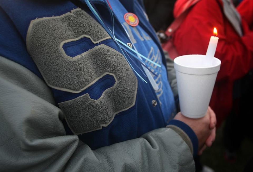 John Welsh is among the Sayreville residents and community leaders participating in a vigil in John F. Kennedy Memorial Park, Sunday, October 12, 2014, in the wake of the high school football hazing scandal that has led to the arrest of seven student athletes.