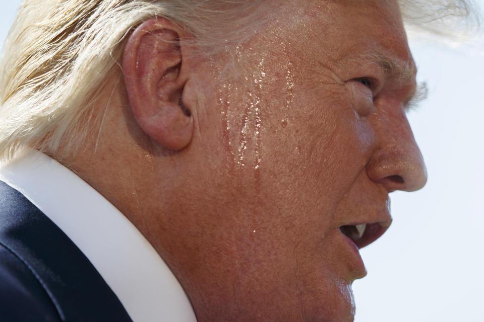 President Trump talks to reporters on the South Lawn of the White House in Washington, D.C., on Friday. (AP Photo/Evan Vucci)  