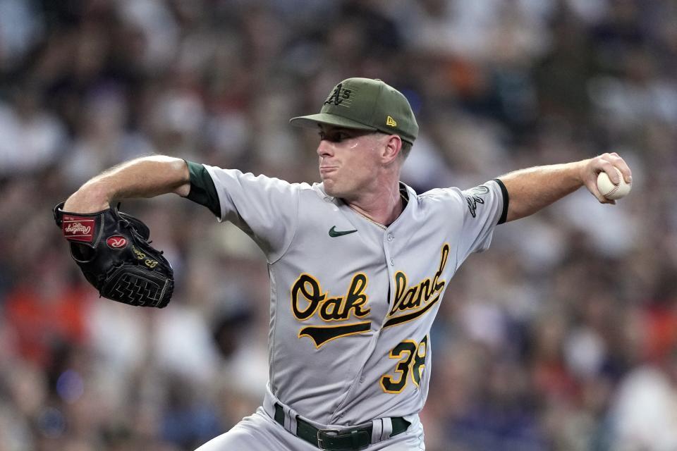 Oakland Athletics starting pitcher J.P. Sears throws against the Houston Astros during the first inning of a baseball game Saturday, May 20, 2023, in Houston. (AP Photo/David J. Phillip)