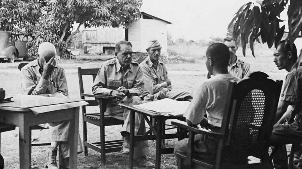 Maj. Gen. Edward P. King (second from left) discusses preliminary terms of surrender on Bataan with Japanese officers following battles along Bataan and Corregidor. - Bettmann Archive/Getty Images