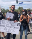 <p><a href="https://people.com/movies/ben-affleck-ana-de-armas-join-california-black-lives-matter-protests/" rel="nofollow noopener" target="_blank" data-ylk="slk:In early June;elm:context_link;itc:0;sec:content-canvas" class="link ">In early June</a>, Affleck and de Armas were among the celebrities marching in support of the Black Lives Matter movement in Los Angeles. </p> <p>The two actors were photographed at a protest in Venice, California, amid several other protesters who were denouncing the demolition of the First Baptist Church of Venice. The photo was shared on Twitter by the @savexvenice account.</p> <p>Affleck wore a dark gray T-shirt and a matching sweater and held up two signs, one of which read, "Save First Baptist Church of Venice," while a smaller one read, "Black Lives Matter."</p> <p>A friend of Affleck's told PEOPLE, "Ben wants to continue to be a model for his children. They talk about these important issues."</p>