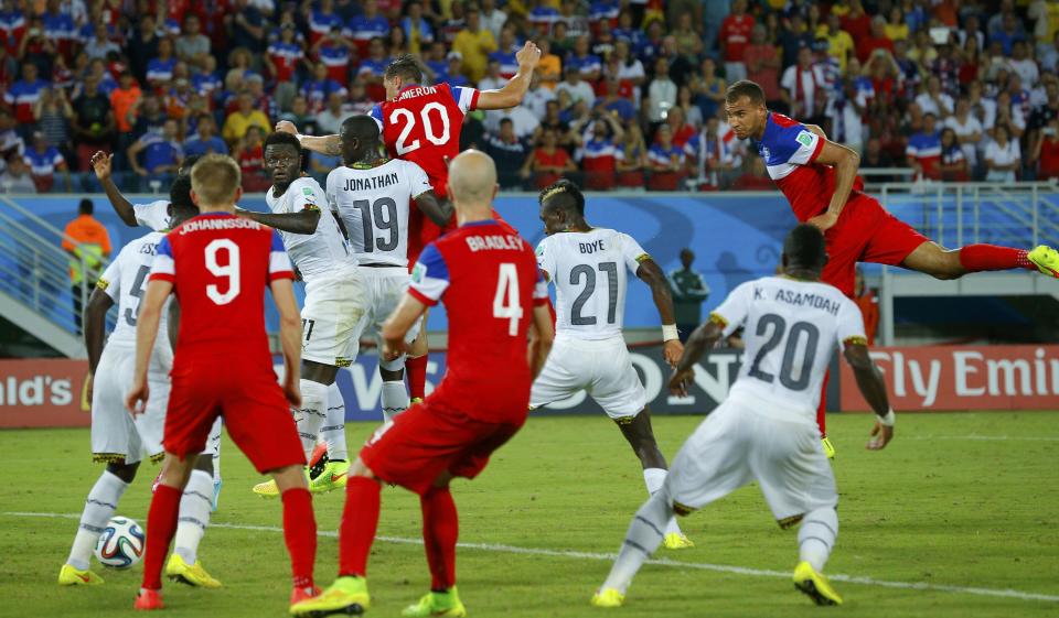 John Brooks (R) of the U.S. scores a goal during the 2014 World Cup Group G soccer match between Ghana and the U.S. at the Dunas arena in Natal June 16, 2014. REUTERS/Brian Snyder
