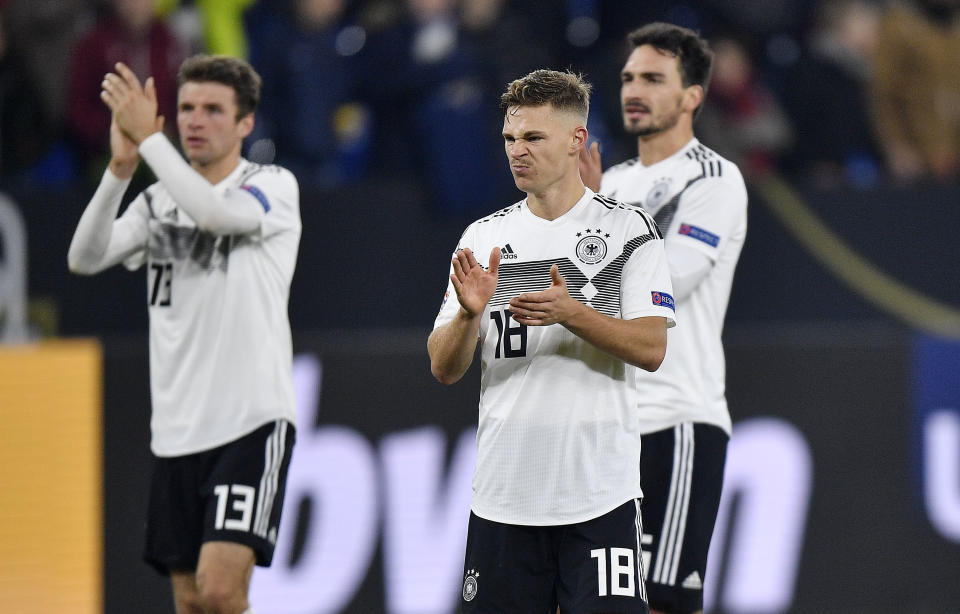 Germany's Thomas Mueller, Germany's Joshua Kimmich and Germany's Mats Hummels, from left, claps hands to fans disappointed after the UEFA Nations League soccer match between Germany and The Netherlands in Gelsenkirchen, Monday, Nov. 19, 2018. The match ended 2-2. (AP Photo/Martin Meissner)