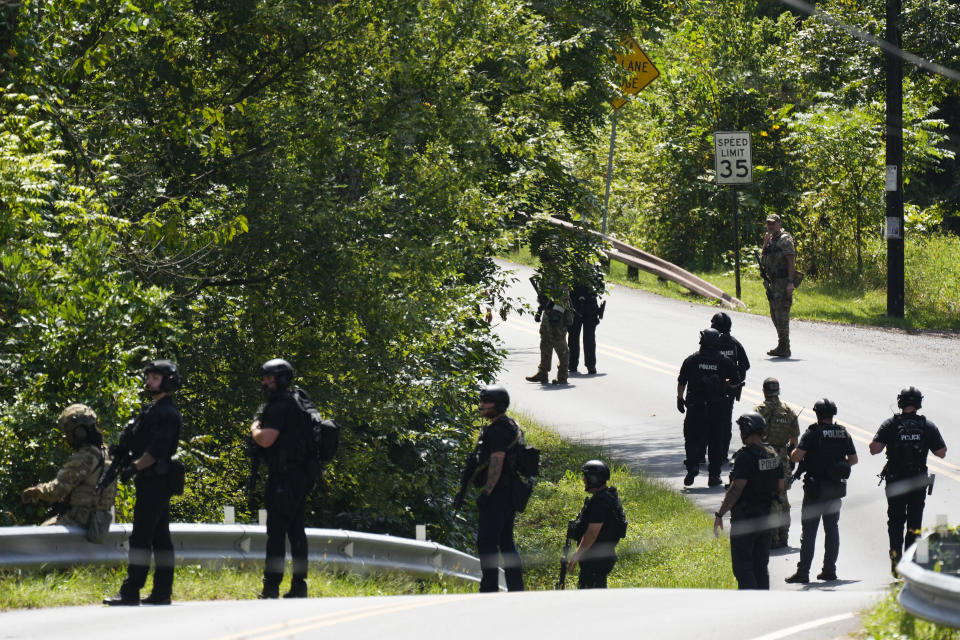Law enforcement officers gather as the search for escaped convict Danelo Cavalcante continues Tuesday, Sept. 12, 2023, in Pottstown, Pa. (AP Photo/Matt Rourke)