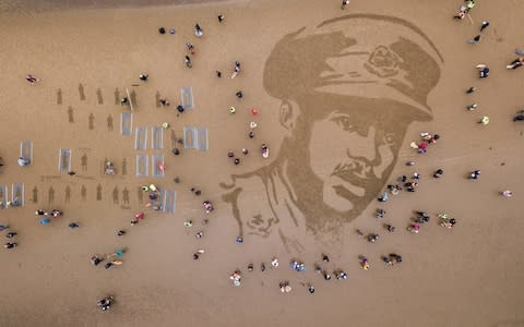 A sand drawing on Ayr Beach of Second Lieutenant Walter Tull - Credit: SWNS