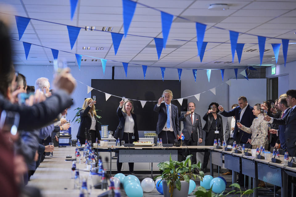 Far-right Party for Freedom leader Geert Wilders, center, and party members raise their glasses after winning the most votes in a general election, in The Hague, Netherlands, Thursday Nov. 23, 2023. (AP Photo/Phil Nijhuis)