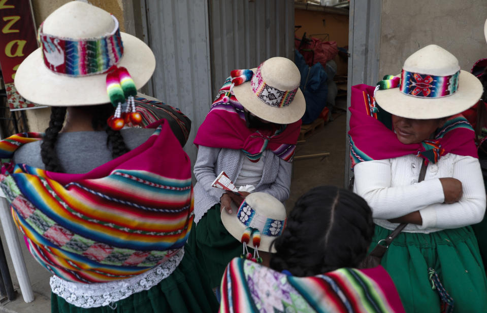 Supporters of Luis Arce, who is running for president for the Movement Towards Socialism Party, MAS, wait for the start of Arce's closing campaign rally in El Alto, Bolivia, Wednesday, Oct. 14, 2020. AP Photo/Juan Karita)