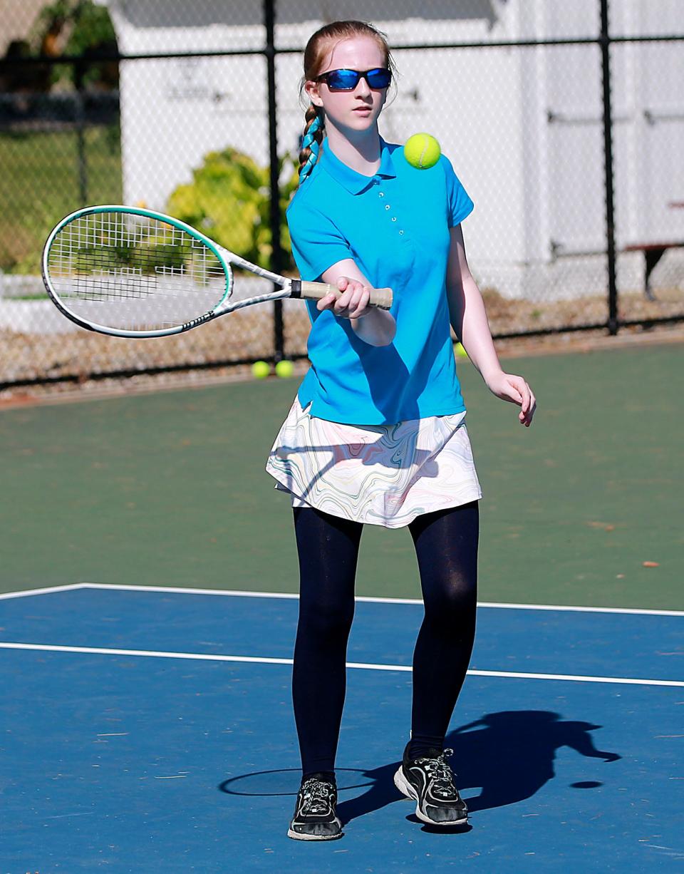 Katherine Birkes returns a volley during her match in the Brookside junior tennis program championships on Thursday, June 30, 2022. TOM E. PUSKAR/ASHLAND TIMES-GAZETTE