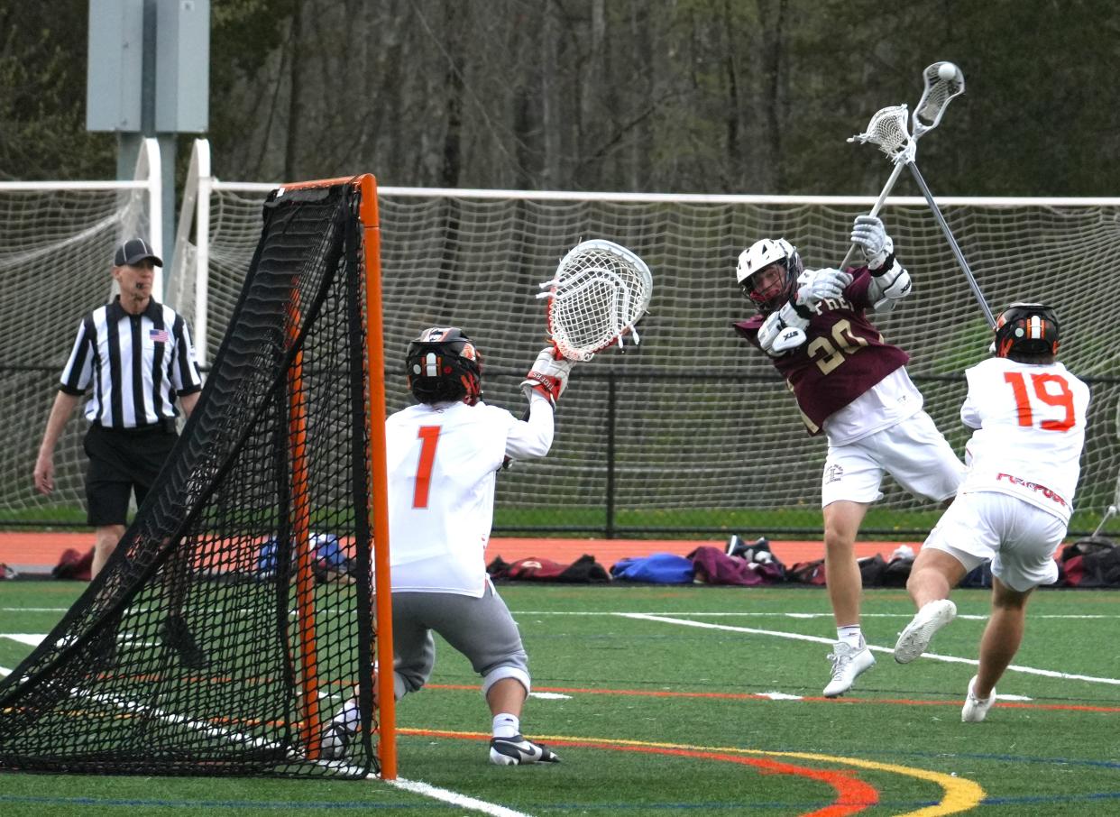 Iona Prep attackman Tim Plunkett unleashes a lefty jump shot for a goal against Ridgefield, Conn. on April 29, 2024. The sophomore netted five goals in a 11-10 overtime loss to the Tigers at Ridgefield High School.