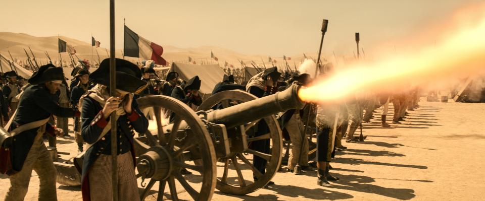 A still from the movie "Napoleon" shows French infantry firing a cannon.
