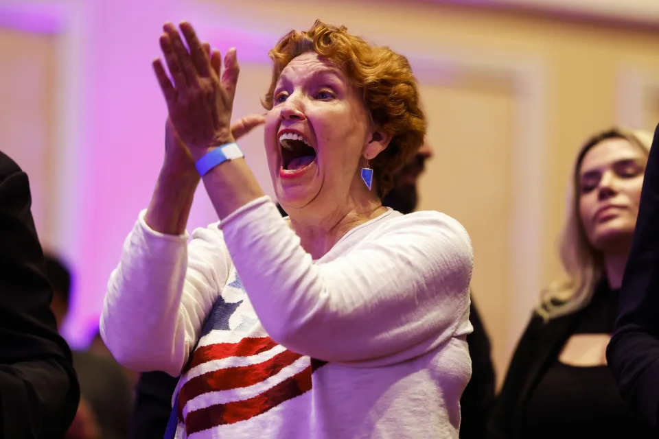 LAS VEGAS, NEVADA - NOVEMBER 08: A supporter cheers as U.S. Sen. Jacky Rosen (D-NV) speaks at an election night party hosted by Nevada Democratic Victory at The Encore on November 08, 2022 in Las Vegas, Nevada. Supporters and candidates gathered to await the results for several key races in the state of Nevada including the Gubernatorial and Senate race. (Photo by Anna Moneymaker/Getty Images)