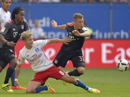 Football Soccer - HSV Hamburg v FC Bayern Munich - German Bundesliga - Volksparkstadion, Hamburg, Germany - 24/09/16 Hamburg's Lewis Holtby and Bayern Munich's Joshua Kimmich in action. REUTERS/Fabian Bimmer