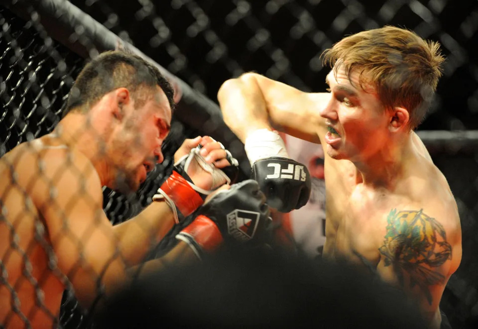 Visalia's Cody Gibson elbows Oakdale's Rolando Velasco fight during Tachi Palace Fights 27 at the Tachi Palace Hotel and Casino in Lemoore on Thursday, May 19, 2016.