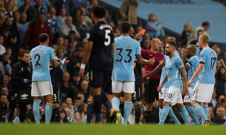 Soccer Football - Premier League - Manchester City vs Everton - Manchester, Britain - August 21, 2017 Manchester City’s Kyle Walker is shown a red card by referee Robert Madley after receiving a second yellow card REUTERS/Phil Noble