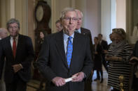 Senate Majority Leader Mitch McConnell, R-Ky., joined by Sen. Roy Blunt, R-Mo., left, and Majority Whip John Cornyn, R-Texas, right, arrives to speak to reporters about the possibility of a partial government shutdown, at the Capitol in Washington, Tuesday, Dec. 18, 2018. Congress and President Donald Trump continue to bicker over his demand that lawmakers fund a wall along the U.S.-Mexico border, pushing the government to the brink of a partial shutdown at midnight Friday. (AP Photo/J. Scott Applewhite)