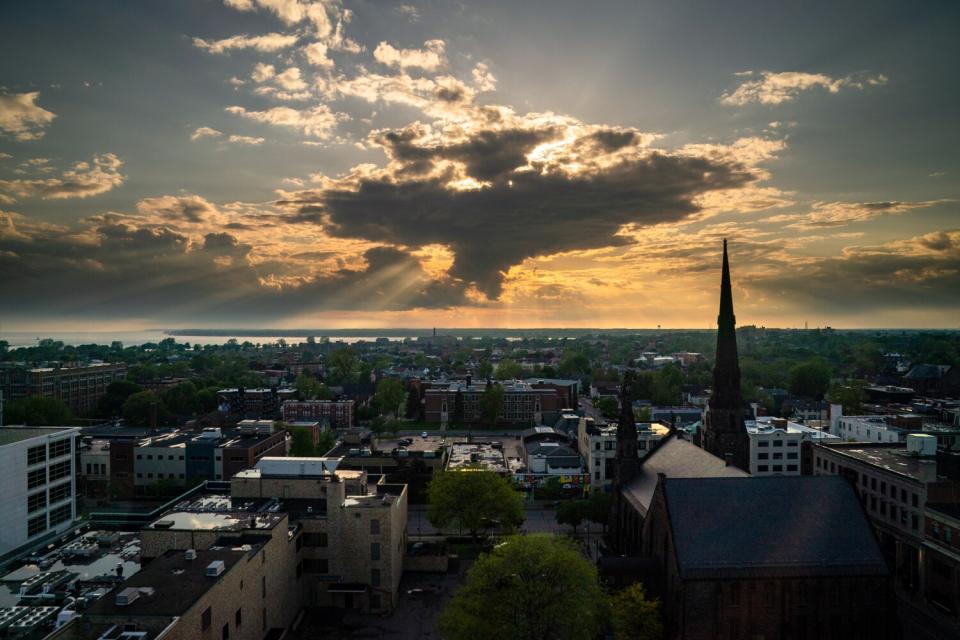 After a rainy morning, the sun peeks through the clouds over Buffalo.