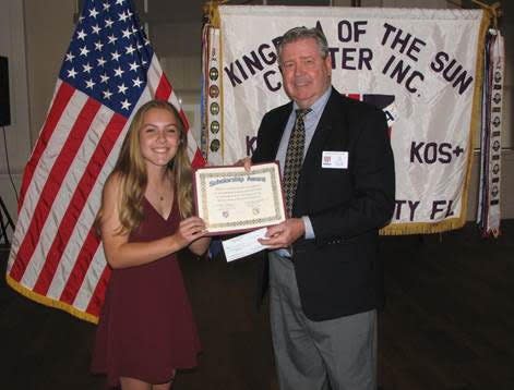 Emily German of Forest High School received a $1,000 KOS Scholarship Award check from KOS President Joe Voge on May 5.