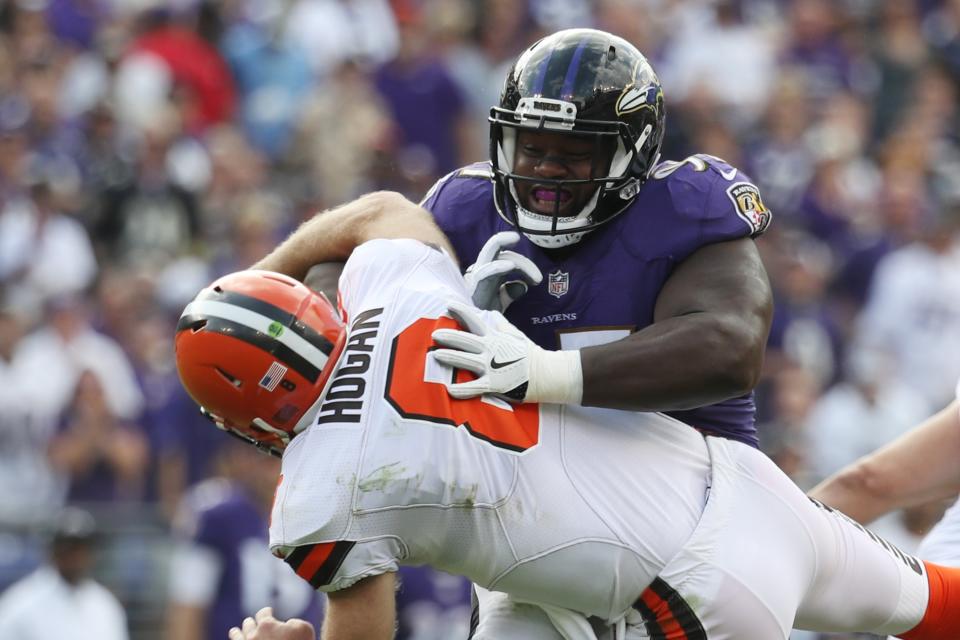 The Ravens' Michael Pierce hits Browns backup quarterback Kevin Hogan in the second quarter. (AP) 