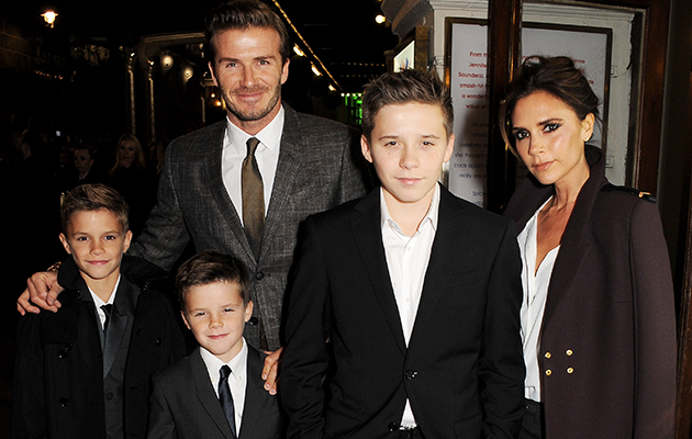 Beckham says he and his wife shower their kids with kisses. Photo: Getty