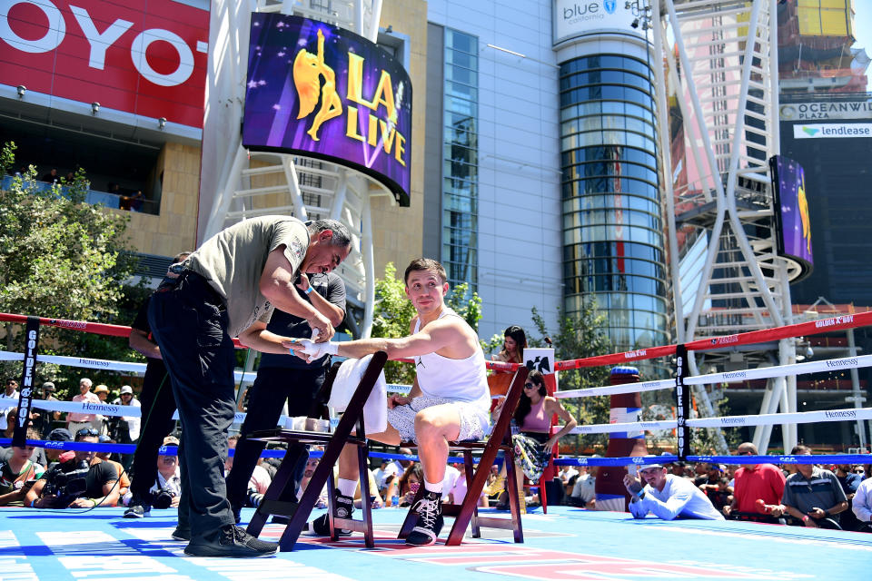 Trainer Abel Sanchez wraps Gennady Golovkin’s hands prior to a workout at Microsoft Square at LA Live in Los Angeles last year. (Getty Images)