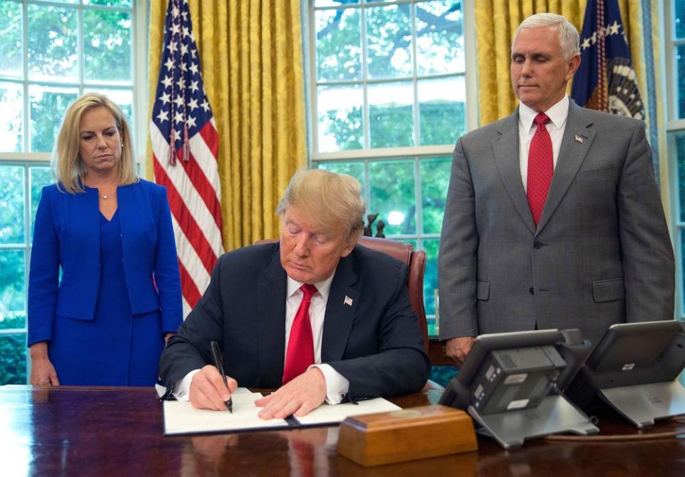 Kirstjen Nielsen, Donald Trump, and Mike Pence