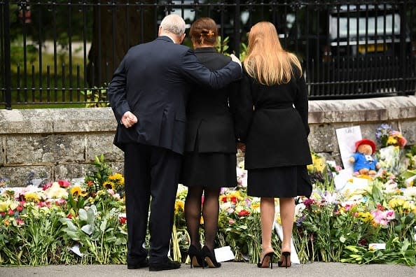 <div class="inline-image__caption"><p>Britain's Prince Andrew, Duke of York (L) stands with his daughters Britain's Princess Eugenie of York (C) and Britain's Princess Beatrice of York as they look at the flowers placed outside Balmoral Castle in Ballater, on September 10, 2022, two days after Queen Elizabeth II died at the age of 96.</p></div> <div class="inline-image__credit">ANDY BUCHANAN/AFP via Getty Images</div>