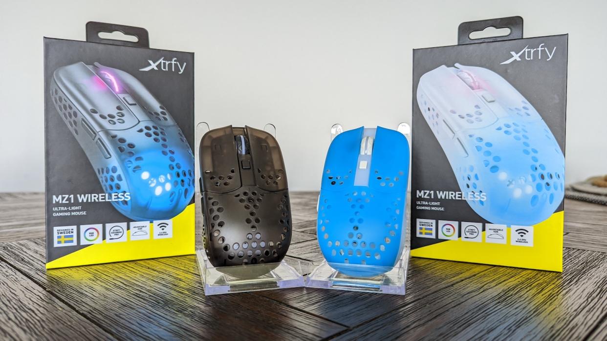 2 MZ1 Wireless mice in black and blue with its packaging on a wooden table. (Photo: Yahoo Gaming SEA)