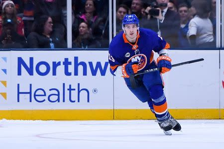 Dec 15, 2018; Uniondale, NY, USA; New York Islanders center Mathew Barzal (13) celebrates his goal on Detroit Red Wings goaltender Jonathan Bernier (45) during shootouts at Nassau Veterans Memorial Coliseum. Mandatory Credit: Dennis Schneidler-USA TODAY Sports