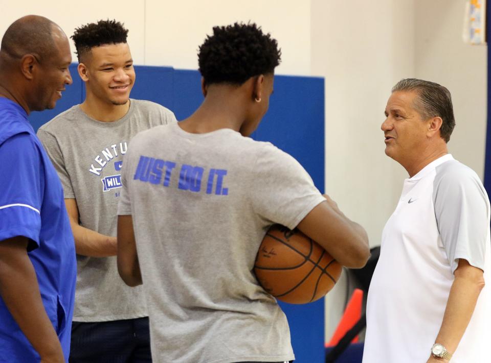 From left, assistant coach Kenny Payne, Kevin Knox, Shai Gilgeous-Alexander and head coach John Calipari share a laugh before UK's practice at the Craft Center in Lexington. Aug. 1, 2018
