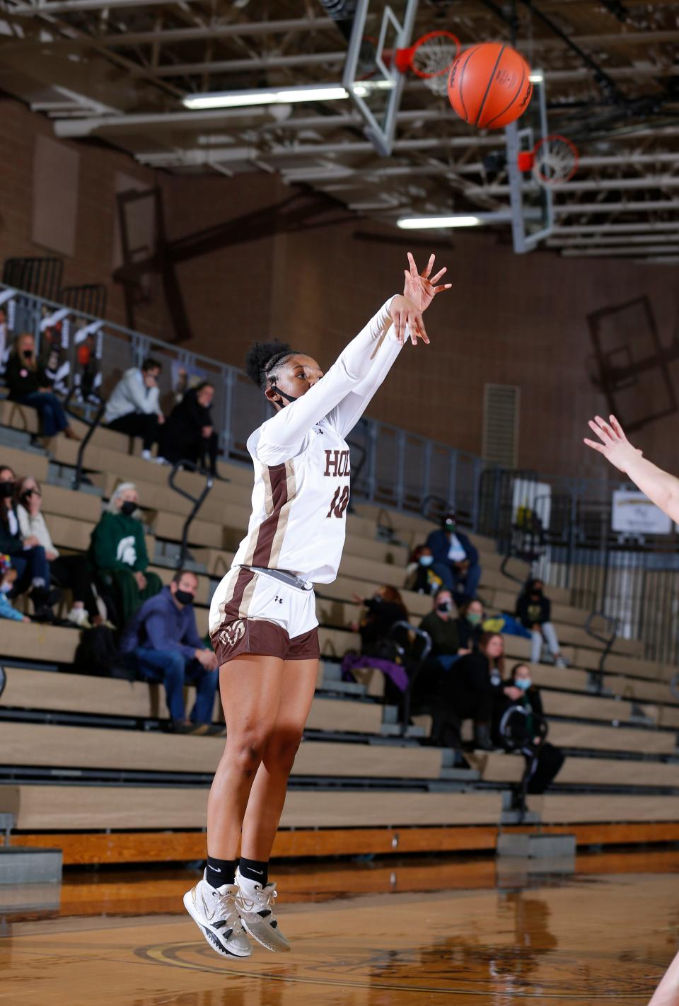 Holt's Rhema Dozier shoots against Williamston, Tuesday, Jan. 25, 2022, in Holt. Holt won 65-52.