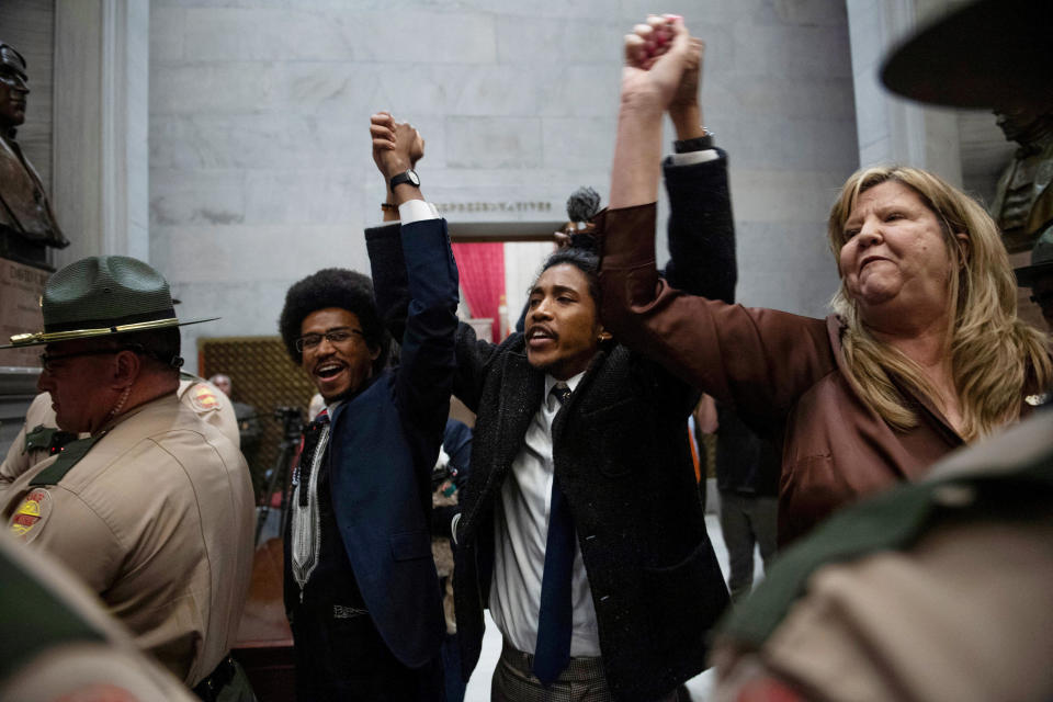 Rep. Justin Pearson, Rep. Justin Jones, Rep. Gloria Johnson hold their hands up as they exit the House Chamber doors at the Tennessee State Capitol Building, in Nashville, Tennessee, April 3, 2023.  / Credit: NICOLE HESTER/USA TODAY NETWORK via Reuters