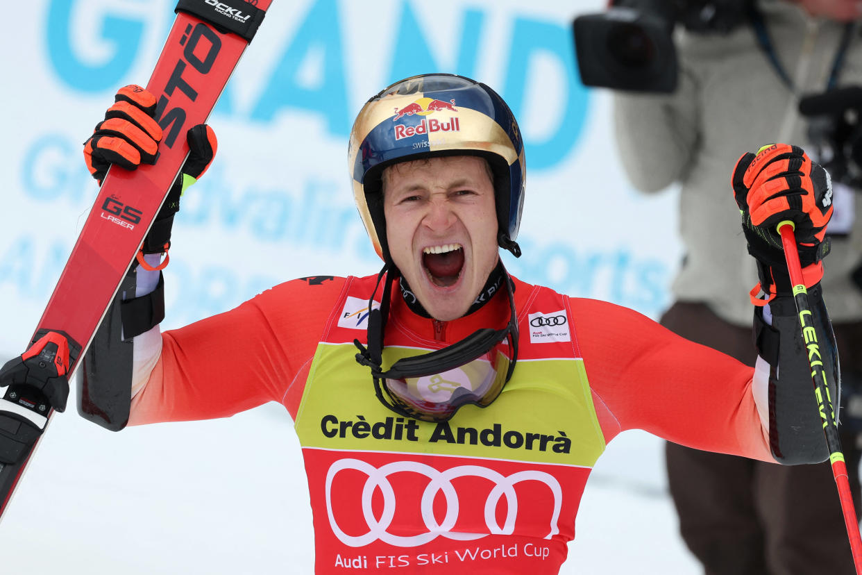 Switzerland's Marco Odermatt celebrates his victory in the finish area after competing in the Men's Giant Slalom event of the FIS Ski World Cup Finals in El Tarter, Andorra on March 18, 2023. (Photo by CHARLY TRIBALLEAU / AFP)