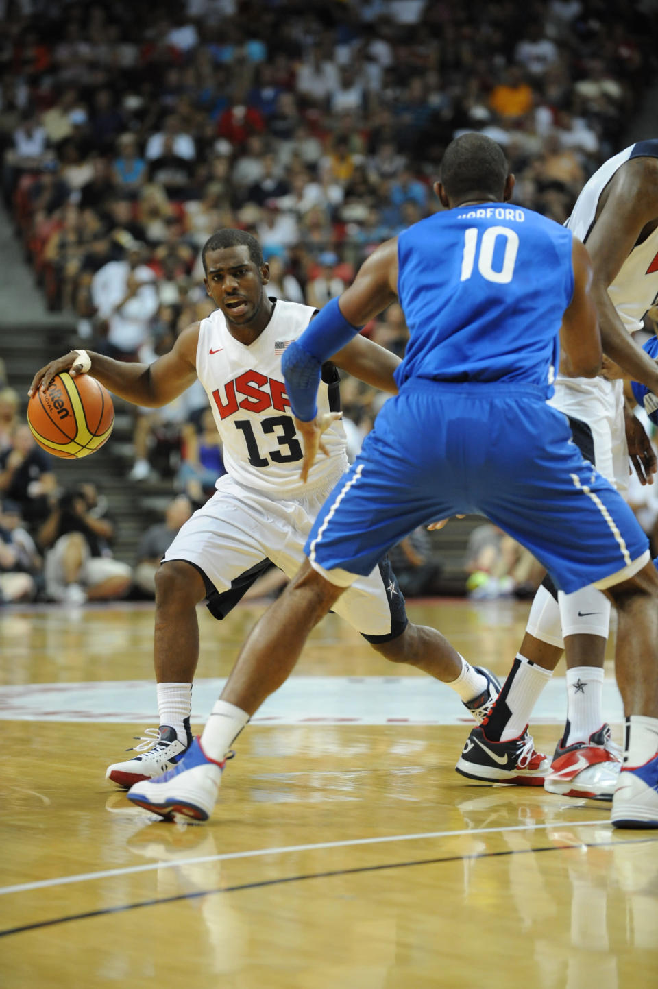 Chris Paul #13 of the US Men's Senior National Team drives against Al Horford #10 of the Dominican Republic during an exhibition game at the Thomas and Mack Center on July 12, 2012 in Las Vegas, Nevada. (Noah Graham/NBAE via Getty Images)