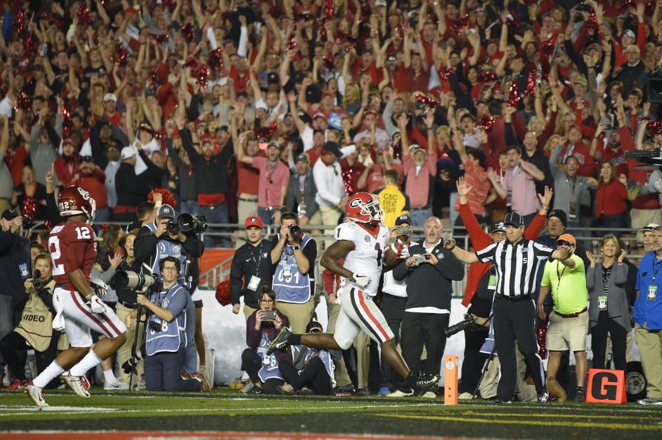 Georgia running back Sony Michel runs for a touchdown during overtime in the Rose Bowl NCAA college football game against Oklahoma, Monday, Jan. 1, 2018, in Pasadena, Calif. Georgia won 54-48. (AP Photo/Mark J. Terrill)