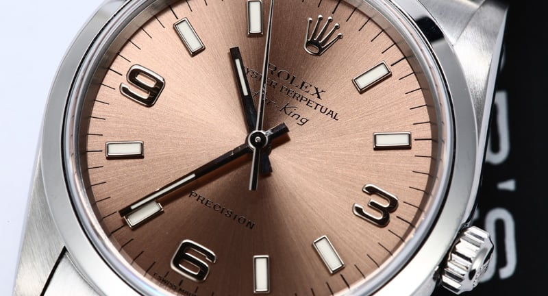 The Rolex Air-King Reference 14000 is usually billed as a salmon dial, but the deep radial brushing and copper tonality create a shimmering bronze effect that is "salmon adjacent" at best when considered alongside vintage examples from Rolex and other makers.