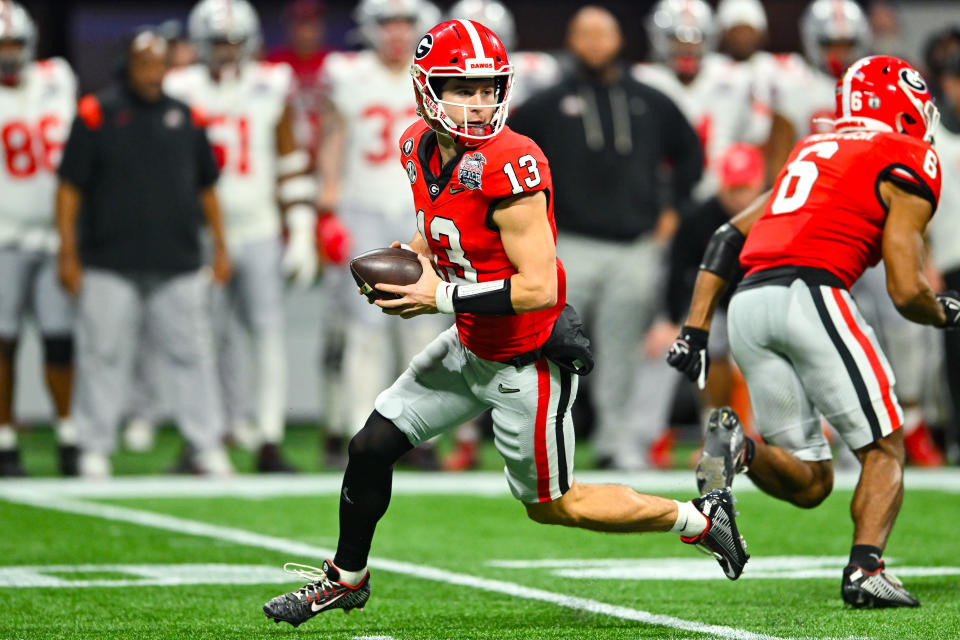 Georgia quarterback Stetson Bennett (13) drops back to pass during the Peach Bowl against Ohio State.  (Photo by Rich von Biberstein/Icon Sportswire via Getty Images)