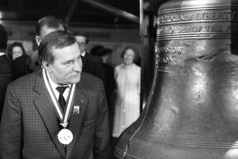 Polish Solidarity leader Lech Walesa examines the crack in the Liberty Bell in Philadelphia on November 19, 1989. On December 9, 1990, Walesa won Poland's first direct presidential vote. UPI File Photo