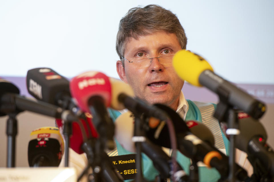 Daniel Knecht, of the Swiss Transportation Safety Investigation Board (STSB), addresses the media during a press conference in Flims, Switzerland, Sunday, Aug. 5, 2018 about the plane crash on Saturday afternoon. The plane, a Junkers Ju-52, crashed on Saturday, Aug. 4, 2018 at the Piz Segnas, all 20 people aboard died. (Melanie Duchene/Keystone via AP)