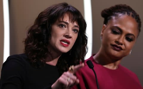  Asia Argento, left, speaks about being raped by Harvey Weinstein at the Cannes Festival closing ceremony - Credit: Vianney Le Caer/ Invision