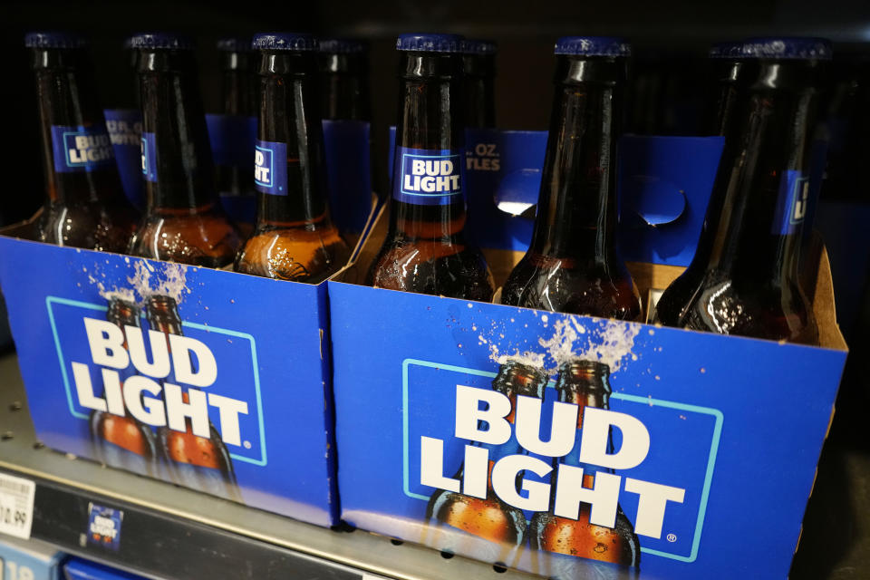 FILE - Bottles of Bud Light beer sit on a shelf at a grocery store on April 25, 2023, in Glenview, Ill. Bud Light's parent company said Thursday, May 4, that it will triple its marketing spending in the U.S. this summer as it tries to boost sales that plummeted after the brand partnered with a transgender influencer. (AP Photo/Nam Y. Huh, File)