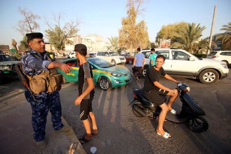 Iraqi security forces check the protesters near the main provincial government building Basra, Iraq July 14, 2018. Picture taken July 14, 2018. REUTERS/Essam al-Sudani