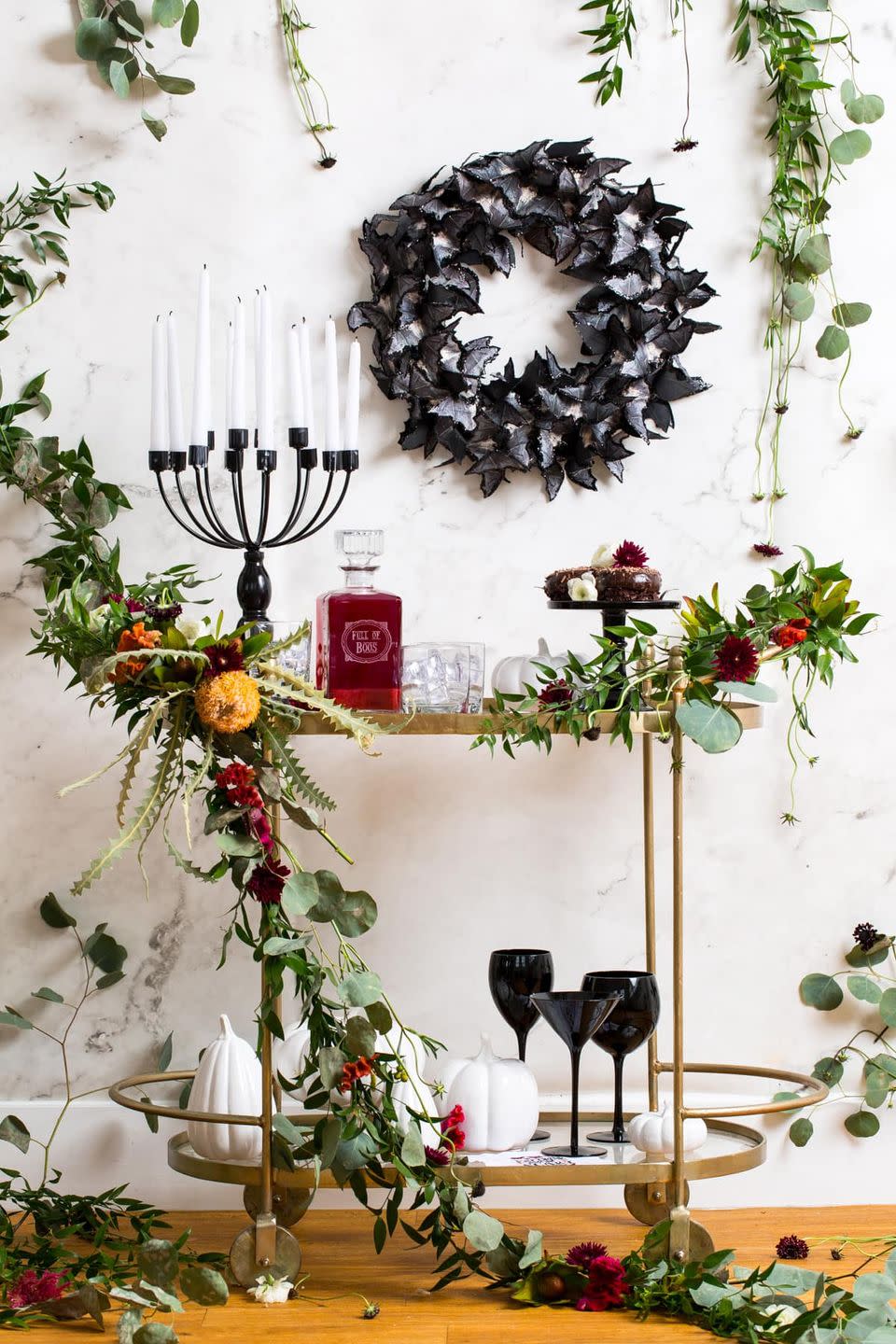 <p>Don't forget to spruce up the bar cart while you're at it! Learn how to make this gorgeous garland (which also works for the fireplace or as a centerpiece) from <a href="https://sugarandcloth.com/spooky-diy-floral-bar-cart-for-halloween/" rel="nofollow noopener" target="_blank" data-ylk="slk:Sugar & Cloth;elm:context_link;itc:0;sec:content-canvas" class="link ">Sugar & Cloth</a>.</p><p><a class="link " href="https://www.amazon.com/Anodized-Aluminum-Training-Multipurpose-Crafting/dp/B078QZSTSB/ref=sr_1_2?tag=syn-yahoo-20&ascsubtag=%5Bartid%7C10057.g.2554%5Bsrc%7Cyahoo-us" rel="nofollow noopener" target="_blank" data-ylk="slk:BUY NOW;elm:context_link;itc:0;sec:content-canvas">BUY NOW</a> <strong><em>Floral Wire, $13</em></strong></p>