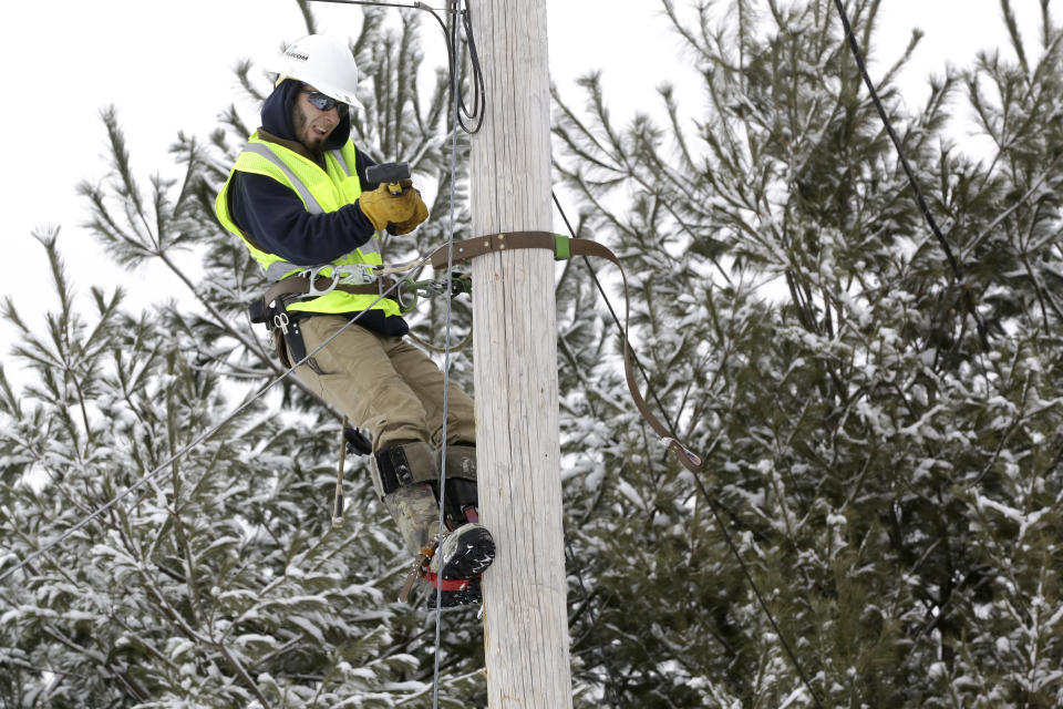 Trevor Haskins, of Waitsfield and Champlain Valley Telecom, works to run fiber fiber optic cable to a home in Concord, Vt., Thursday Feb. 10, 2022. The nationwide need to connect homes and businesses to high-speed broadband services was highlighted by the COVID-19 pandemic and officials say that while there is lots of money available, supply and labor shortages are making the expansion a challenge. (AP Photo/Wilson Ring)