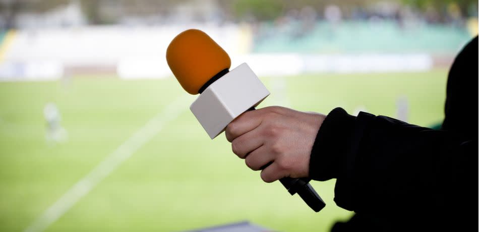 sports reporter with microphone