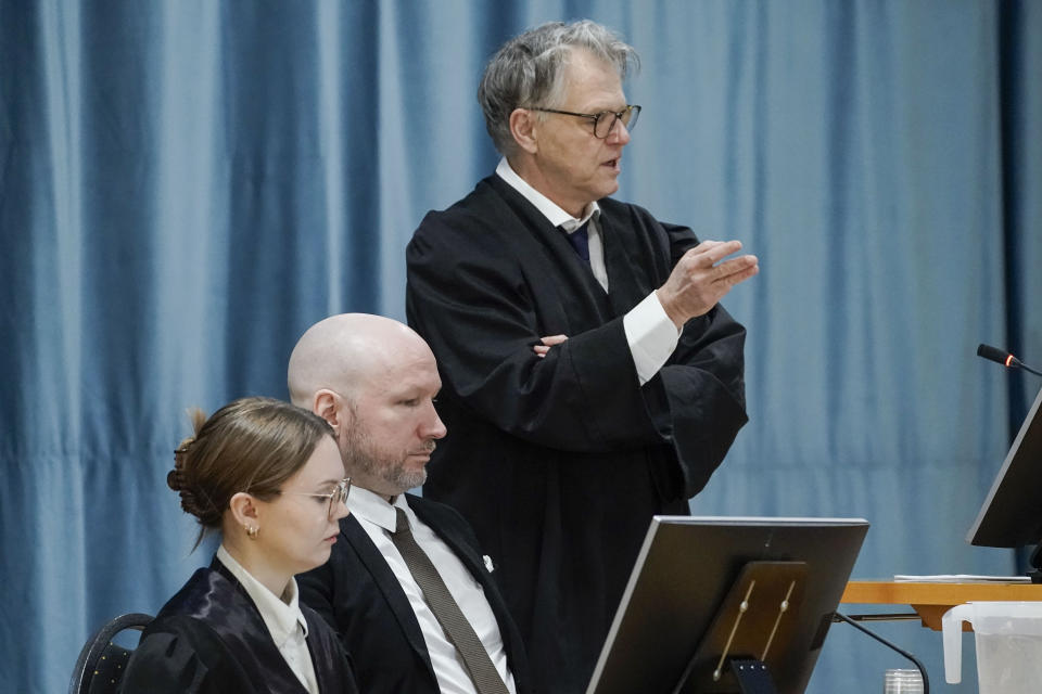 Anders Behring Breivik sits between his representatives, lawyer Øystein Storrvik, right and associate attorney Marte Lindholm, as the Oslo district court conducts his case in a gymnasium at Ringerike prison, in Ringerike, Norway, Monday, Jan. 8, 2024. Breivik, who slayed 77 people in an anti-Islamic bomb and gun rampage in 2011, appeared in court on Monday in a bid to sue the Norwegian state for breaching his human rights. Norway’s worst peacetime killer says his solitary confinement since being jailed in 2012 amounts to inhumane treatment under the European Convention of Human Rights. (Cornelius Poppe/NTB Scanpix via AP)