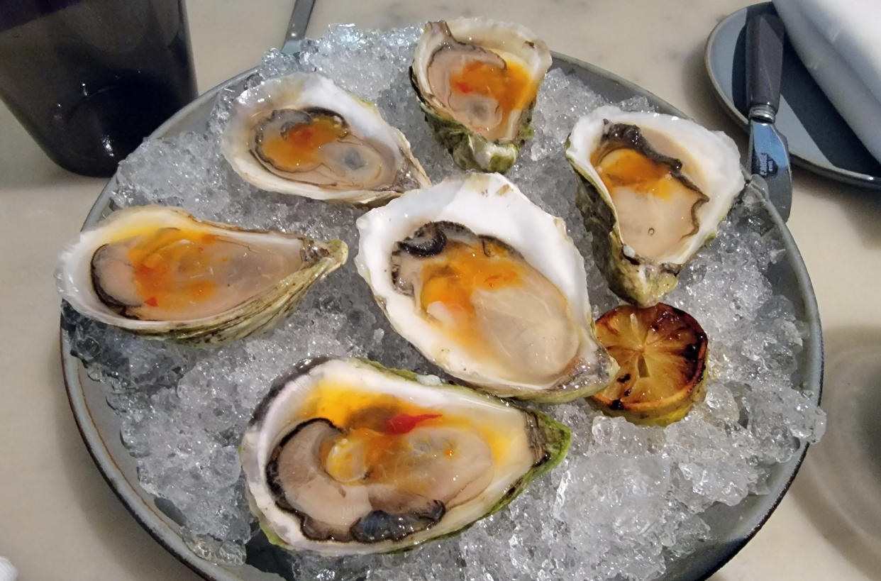 Prince Edward Island oysters with kumquat mignonette and charred lime at The Modern. (Courtesy Eric Finkelstein)