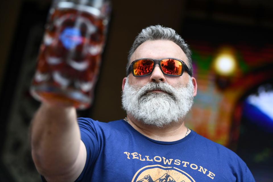 Joe Shepherd of Greenback, TN, earned a first place finish during a stein hoisting competition at Schulz BrÃ¤u Brewing Company during their 2nd Annual Maifest on Saturday, May 13, 2023. 