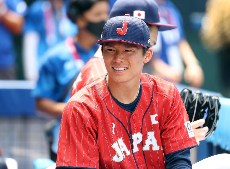 YOKOHAMA, JAPAN - JULY 31: Yoshinobu Yamamoto #17 of Team Japan looks on before the game against Team Mexico during the baseball opening round Group A game on day eight of the Tokyo 2020 Olympic Games at Yokohama Baseball Stadium on July 31, 2021 in Yokohama, Kanagawa, Japan. (Photo by Koji Watanabe/Getty Images)