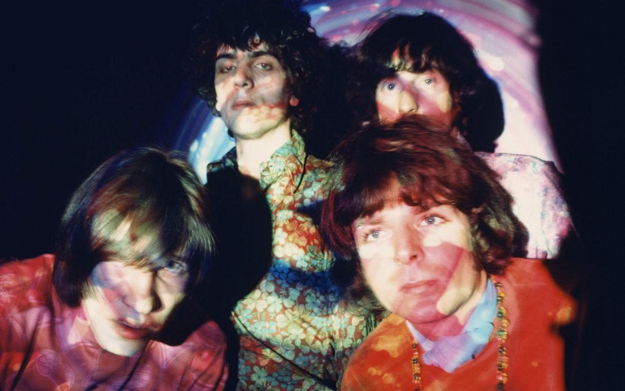 Pink Floyd photographed against psychedelic light - Andrew Whittuck/Redferns / Getty Images